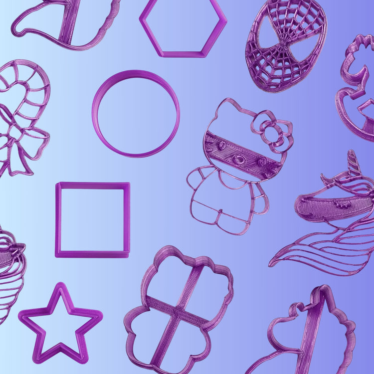 A collection of purple cookie cutters featuring various shapes including a star, circle, square, candy cane, unicorn, Hello Kitty, and Spider-Man mask arranged on a blue-to-purple gradient background.