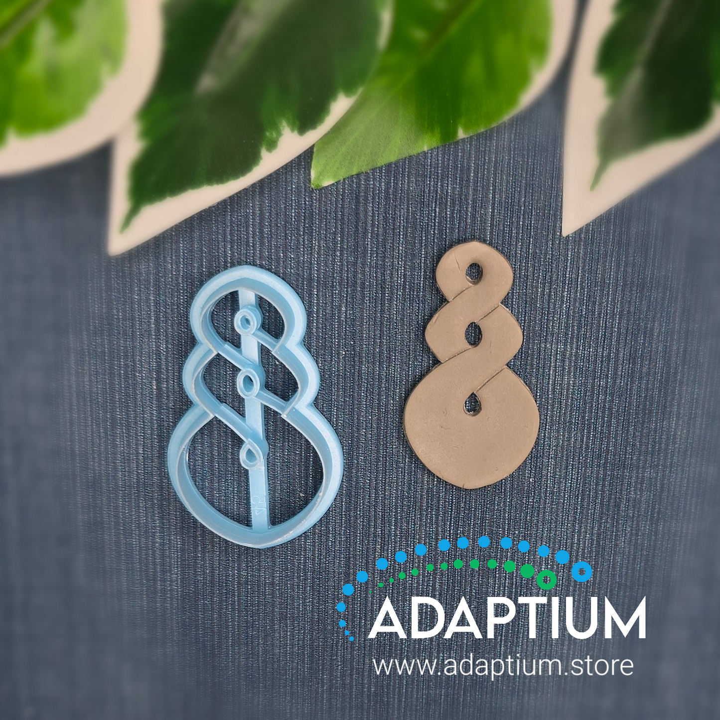 A raw piece of polymer clay cut out from the pale blue resin pikorua twist cutter