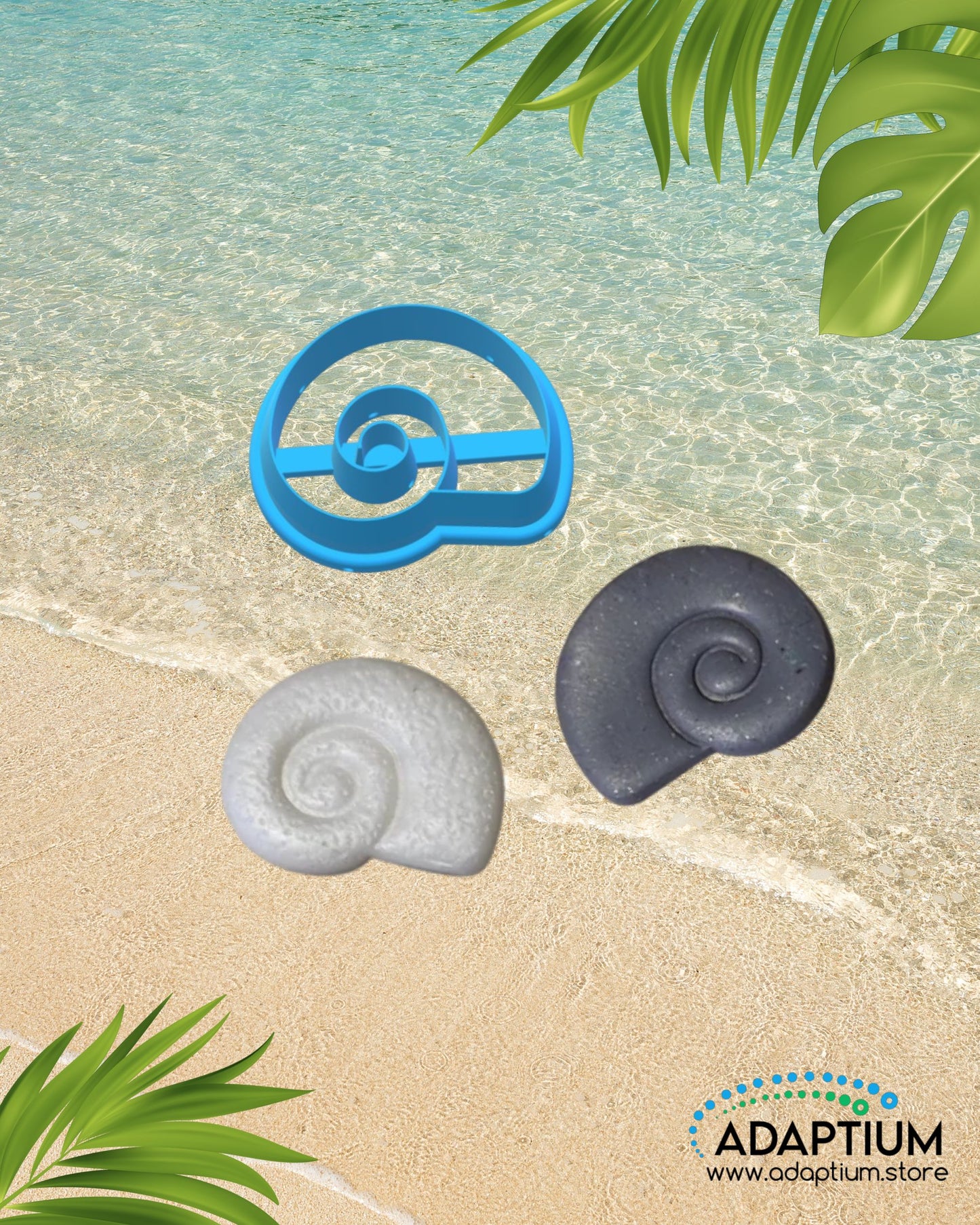 Conch spiral shell shaped polymer clay cutter with two clay samples in colors gray and white placed on sandy beach background with ocean water and tropical leaves.