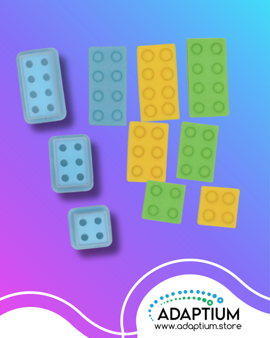 Toy brick-inspired polymer clay cutters in blue with matching yellow, green, and blue clay block cutouts on a gradient background.