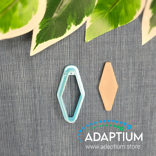 A raw piece of polymer clay cut out from the pale blue resin long diamond cutter 